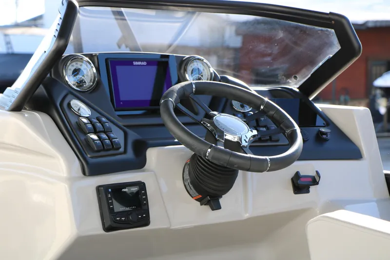Slide: The Image of 2026 Sylvan L3 CLZ DH boat dashboard with steering wheel and control panel. - 22