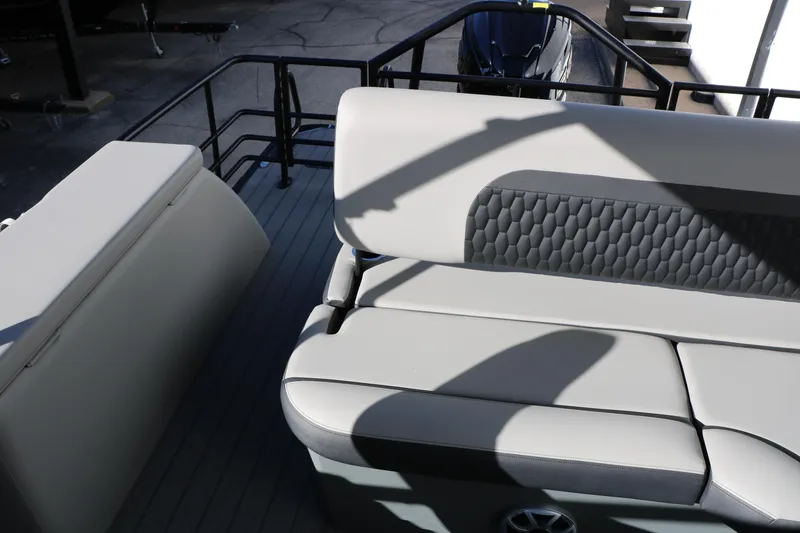 Slide: The Image of 2026 Sylvan L3 CLZ DH boat interior with cushioned seating and modern design. - 26