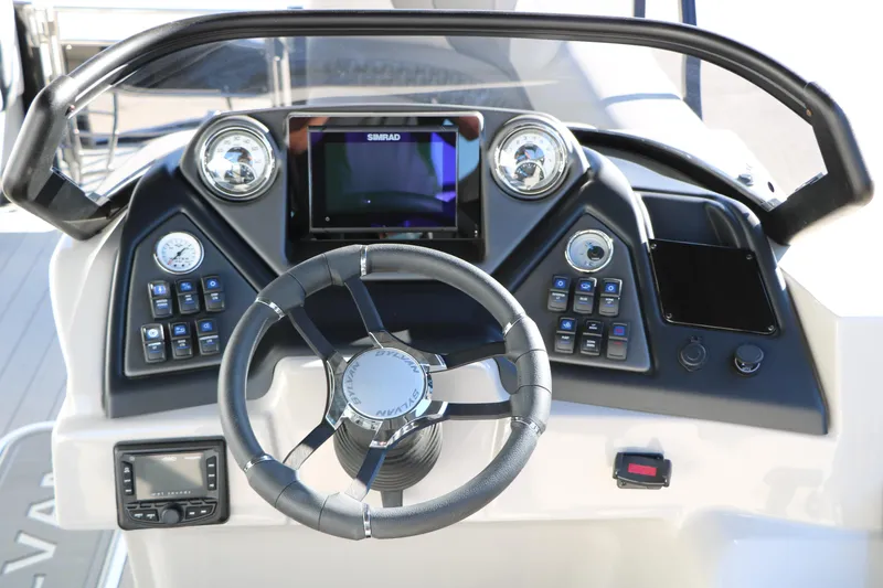 Slide: The Image of Steering console of 2026 Sylvan L3 CLZ DH boat with modern controls and display. - 29