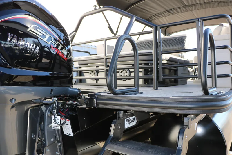 Slide: The Image of 2026 Sylvan L3 CLZ DH pontoon boat with Yamaha engine, rear view. - 35