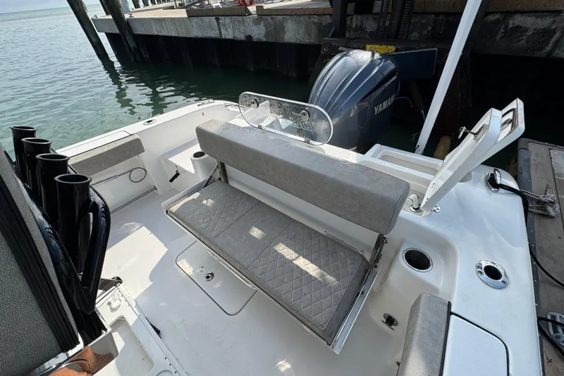 Slide: The Image of 2023 Sea Pro 239 Deep V CC boat interior with seating and Yamaha outboard motor. - 27