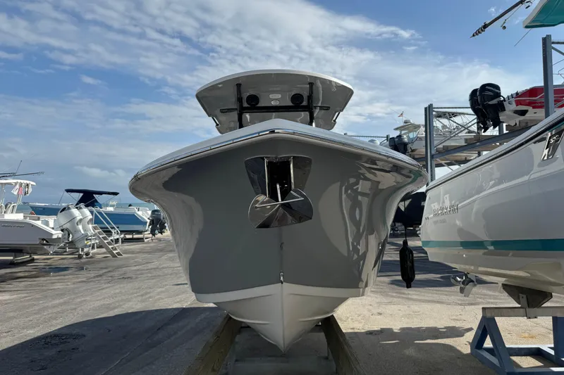 Slide: The Image of 2023 Sea Pro 239 Deep V CC boat on display at a marina. - 3