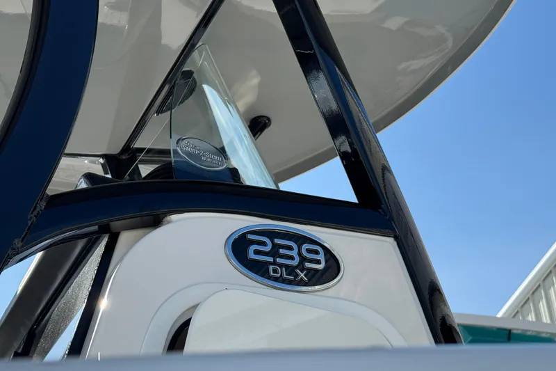 Slide: The Image of 2023 Sea Pro 239 Deep V CC boat, close-up of model badge and structure. - 31