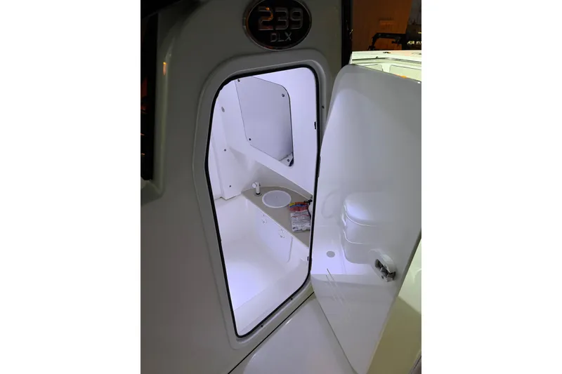 Slide: The Image of Interior view of 2023 Sea Pro 239 Deep V CC boat cabin with open door. - 43