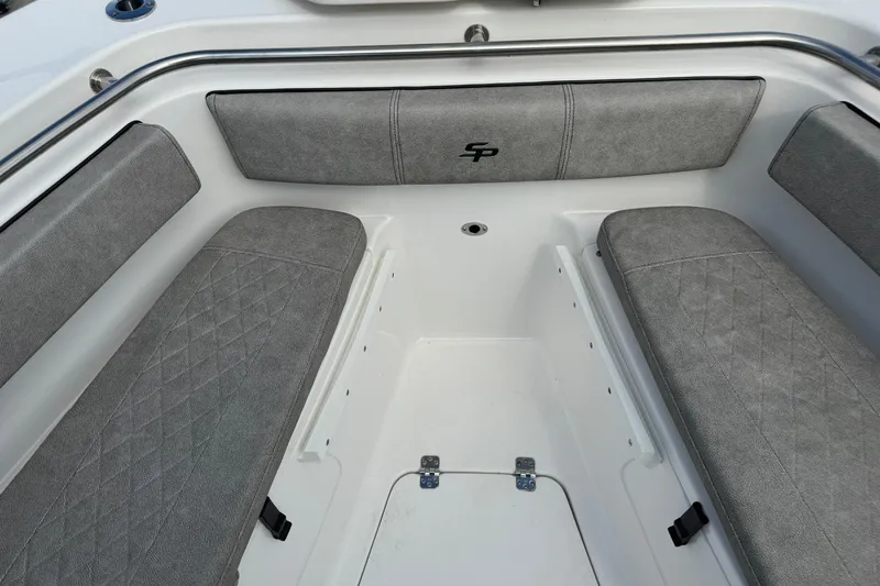 Slide: The Image of 2023 Sea Pro 239 Deep V CC boat interior with gray cushioned seating. - 9