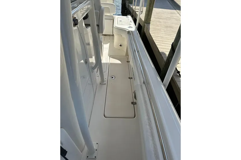 Slide: The Image of 2018 Blackwood 27 Bayboat console with storage compartment and cup holders. - 14