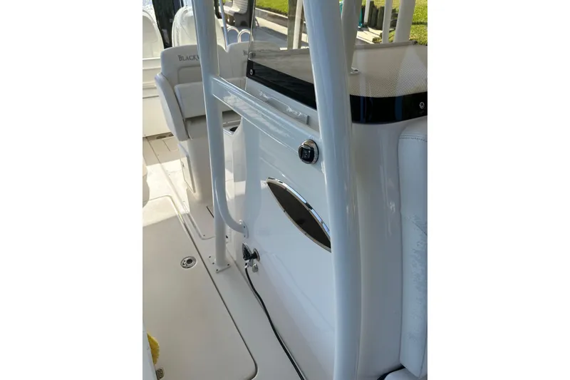 Slide: The Image of 2018 Blackwood 27 Bayboat cockpit with modern navigation system and steering wheel. - 15