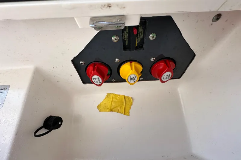 Slide: The Image of Control panel with switches on a 2018 Blackwood 27 Bayboat. - 19