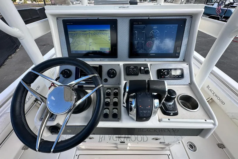Slide: The Image of 2018 Blackwood 27 Bayboat helm with dual displays and modern controls. - 20