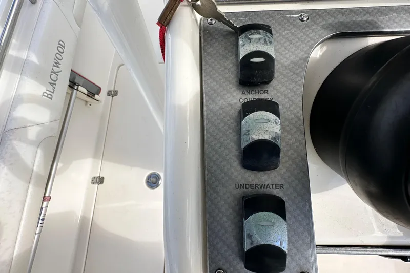 Slide: The Image of 2018 Blackwood 27 Bayboat dashboard with steering wheel, dual screens, and controls. - 21