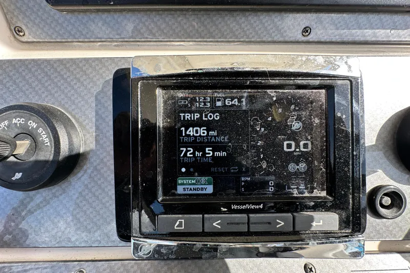 Slide: The Image of 2018 Blackwood 27 Bayboat dashboard with steering wheel and modern controls. - 22