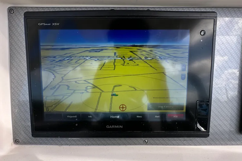 Slide: The Image of Control panel of a 2018 Blackwood 27 Bayboat with labeled switches for anchor, courtesy, and underwater lights. - 24