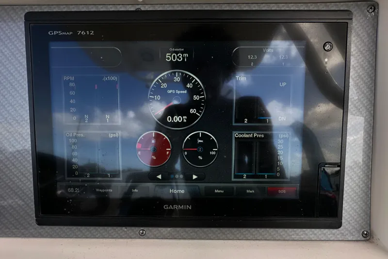 Slide: The Image of 2018 Blackwood 27 Bayboat dashboard with trip log display showing 1406 miles and 72 hours. - 25