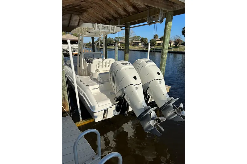 Slide: The Image of 2018 Blackwood 27 Bayboat with twin Verado 350 engines, featuring joystick piloting. - 3