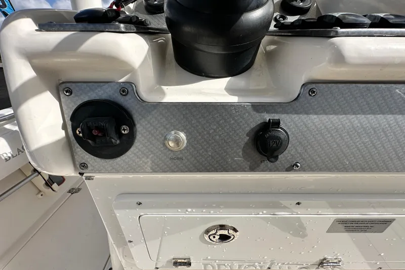 Slide: The Image of Control panel of a 2018 Blackwood 27 Bayboat featuring Lenco and Garmin systems. - 30