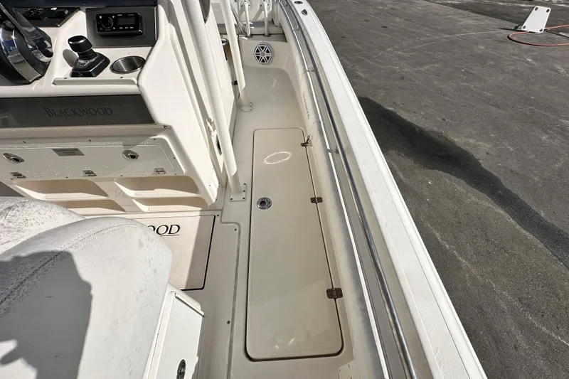 Slide: The Image of 2018 Blackwood 27 Bayboat underside view with speakers and storage compartment. - 37