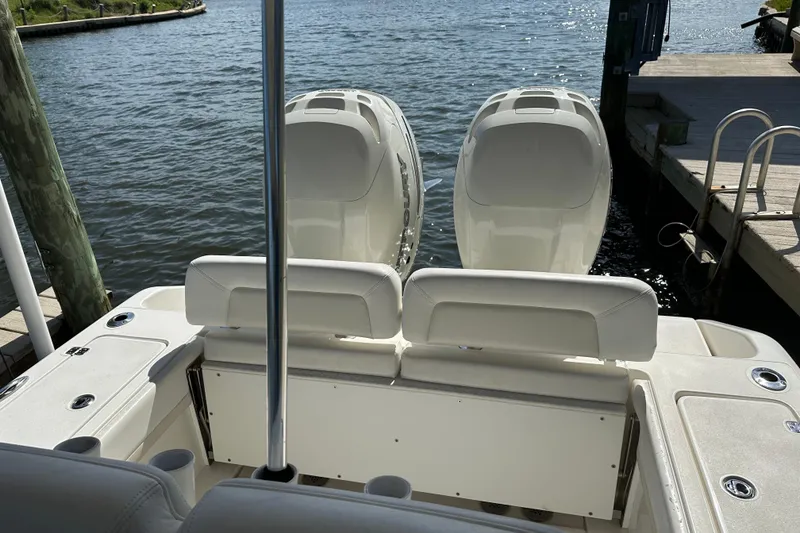 Slide: The Image of 2018 Blackwood 27 Bayboat with dual propellers, viewed from the rear on a sunny day. - 4