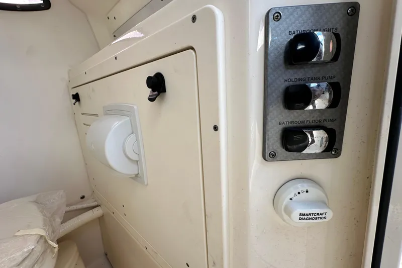 Slide: The Image of 2018 Blackwood 27 Bayboat interior with storage compartment and branded flooring. - 42