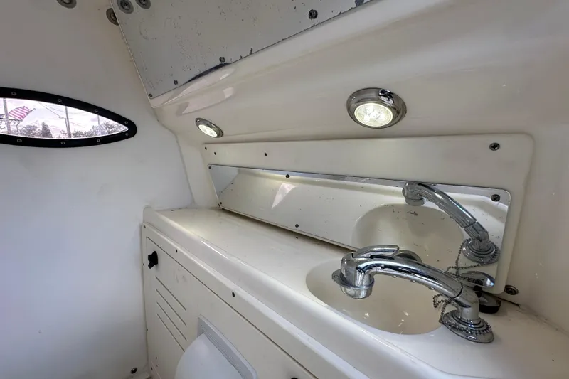 Slide: The Image of 2018 Blackwood 27 Bayboat, sleek design, sunny day, marina background. - 43