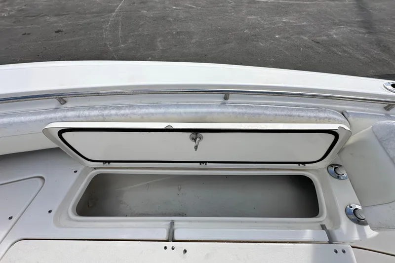 Slide: The Image of 2018 Blackwood 27 Bayboat interior with cushioned seating and speakers. - 52