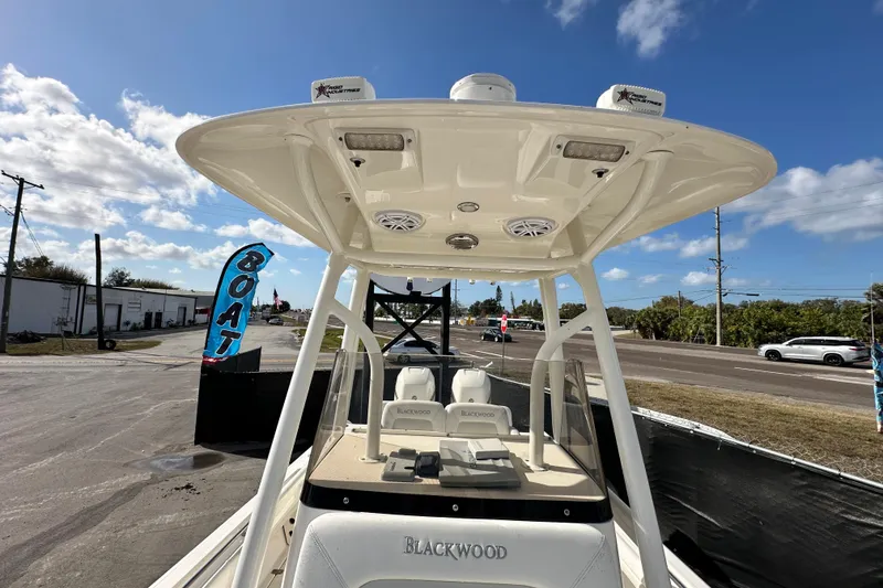 Slide: The Image of Open storage compartment on a 2018 Blackwood 27 Bayboat, showcasing interior space. - 66
