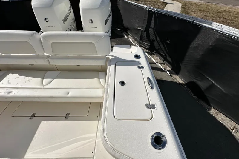 Slide: The Image of 2018 Blackwood 27 Bayboat with spacious deck and seating, parked near a road. - 72