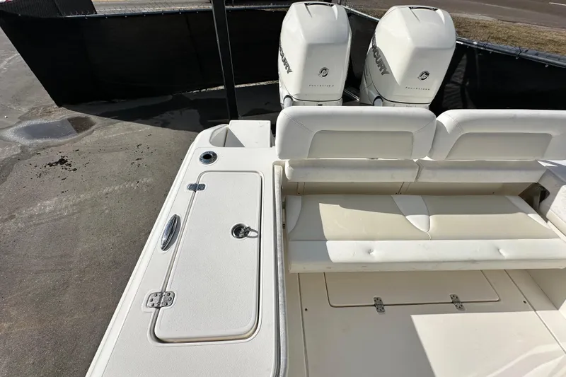 Slide: The Image of 2018 Blackwood 27 Bayboat with spacious seating, under a clear blue sky. - 74