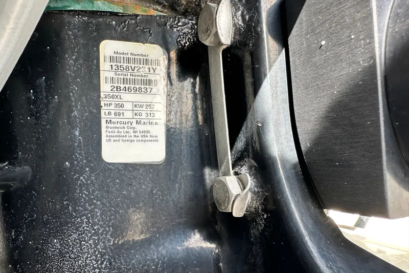 Slide: The Image of 2018 Blackwood 27 Bayboat with dual outboard engines and white seating. - 82