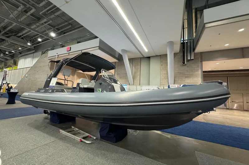 The Image of 2026 Zodiac Medline 7.5 inflatable boat displayed indoors at a boat show. - 1