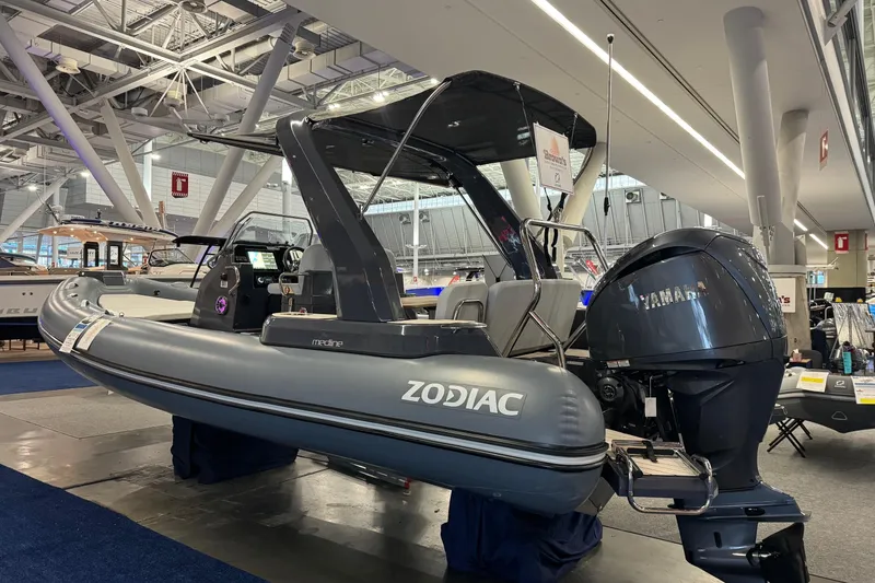Slide: The Image of 2026 Zodiac Medline 7.5 boat displayed indoors with Yamaha engine. - 5