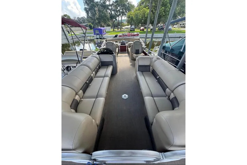 Slide: The Image of 2023 Sun Tracker Party Barge 24 DLX interior with spacious seating and modern design. - 7