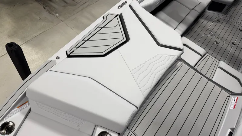 Slide: The Image of The image shows a boat's modern interior with gray and white upholstery. - 15