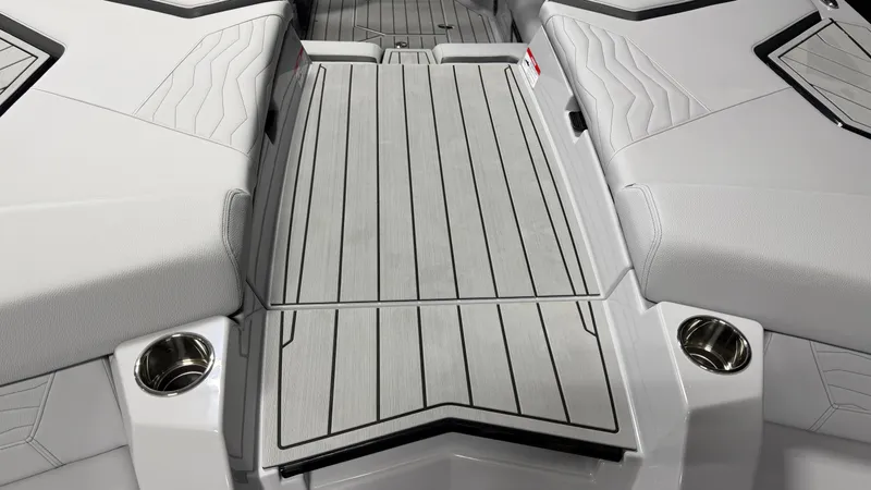 Slide: The Image of The image shows the interior of a boat with gray upholstery and cup holders. - 19