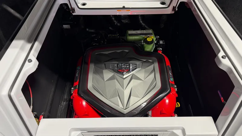 Slide: The Image of A powerful engine inside a boat, surrounded by red and black components. - 20