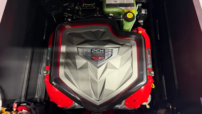 Slide: The Image of Close-up of a powerful boat engine with distinctive design and red accents. - 21