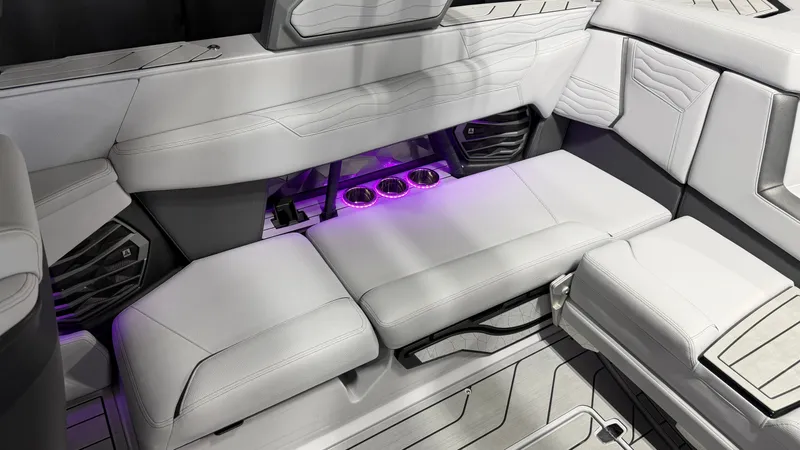 Slide: The Image of Luxurious white boat seating with purple lighting and speakers. - 28