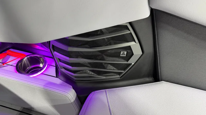 Slide: The Image of Close-up of a speaker and cup holder with purple lighting. - 30
