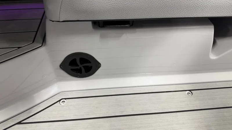 Slide: The Image of Close-up of a boat seat with speaker and wooden flooring. - 31
