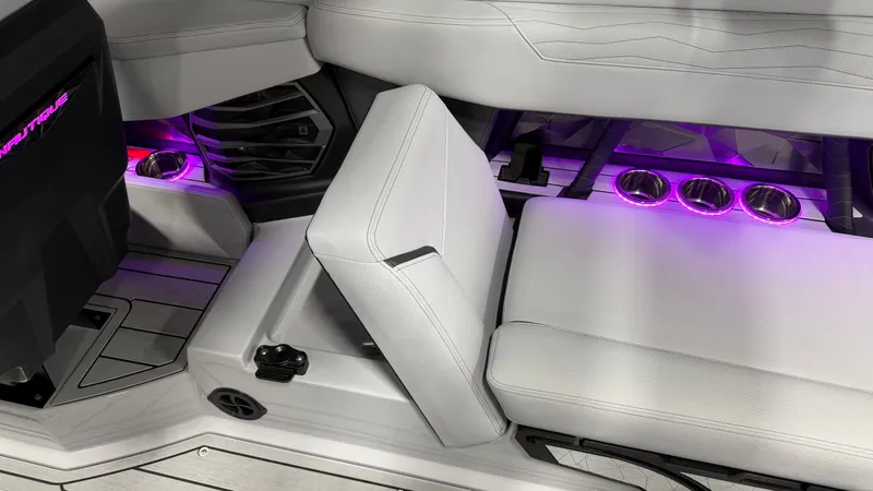 Slide: The Image of Interior of a modern boat with purple lighting and white seating. - 33