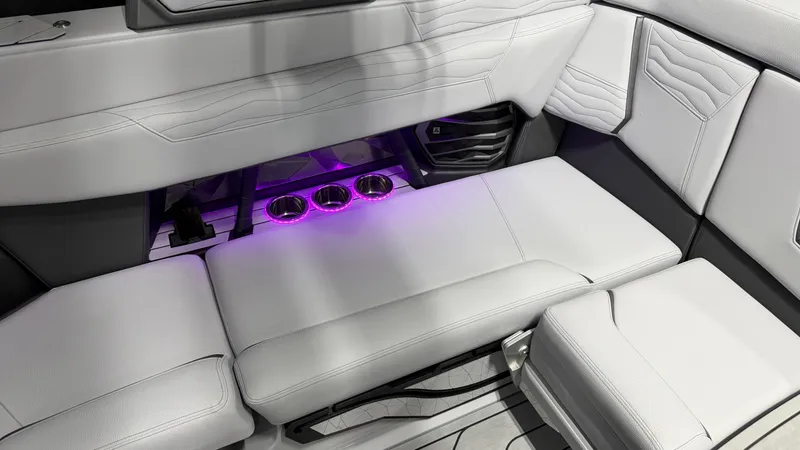 Slide: The Image of Interior of a boat with white upholstery and purple-lit cup holders. - 34