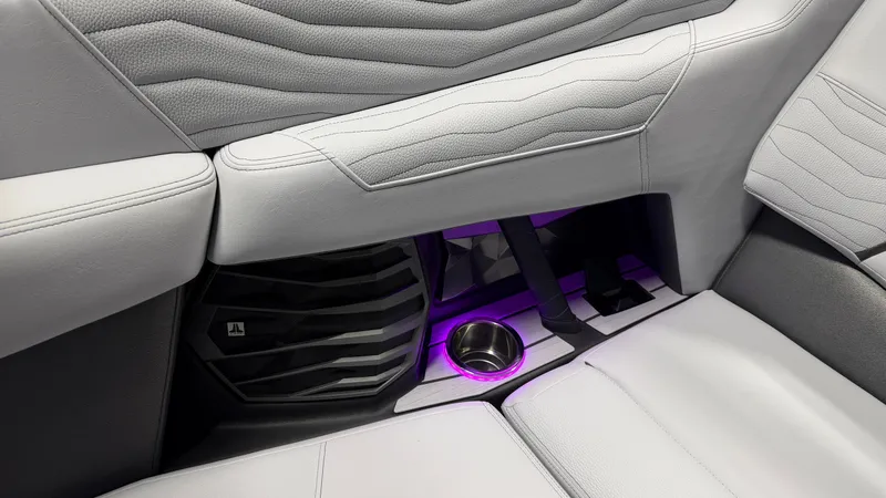 Slide: The Image of Interior of a boat with gray upholstery and purple lighting. - 48