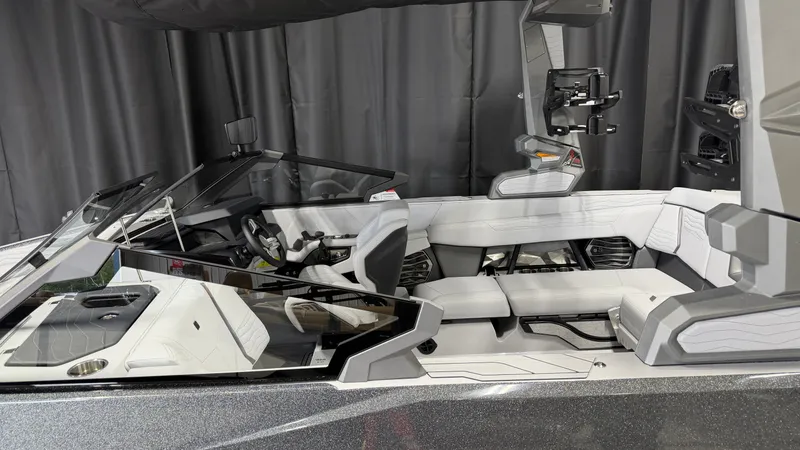 Slide: The Image of The interior of a modern boat with white seating and a sleek helm station. - 5