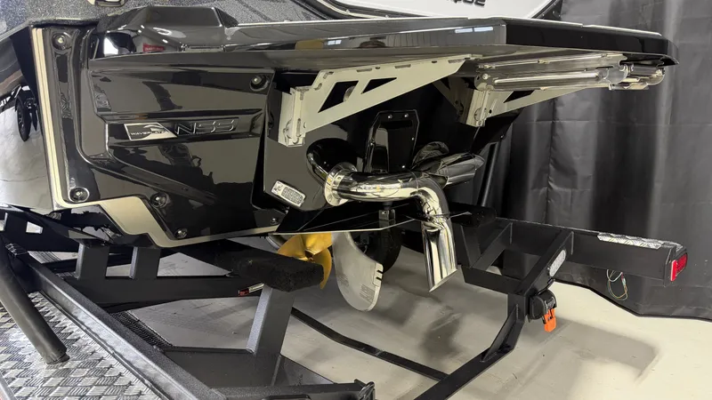 Slide: The Image of The rear of a Nautique Super Air Nautique G23 boat on a trailer. - 7