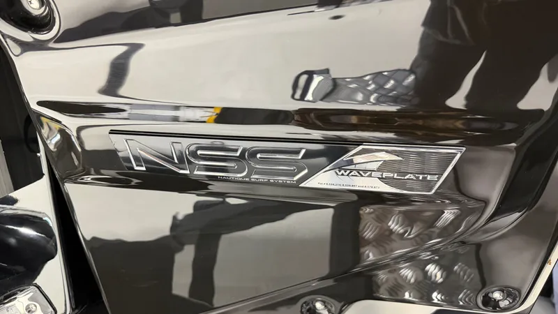 Slide: The Image of Close-up of a shiny boat detail with the "NSS Waveplate" logo. - 8