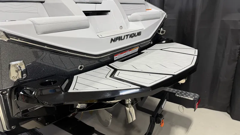 Slide: The Image of The rear of a Nautique boat with a platform and cushions is visible. - 9