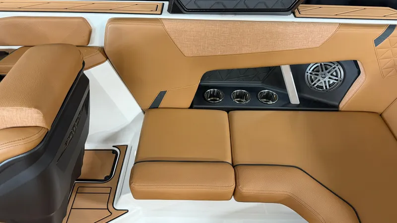 Slide: The Image of The image shows a boat interior with brown upholstery and cup holders. - 29