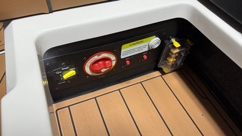 Slide: The Image of A control panel with switches and a red rotary knob on a boat. - 41