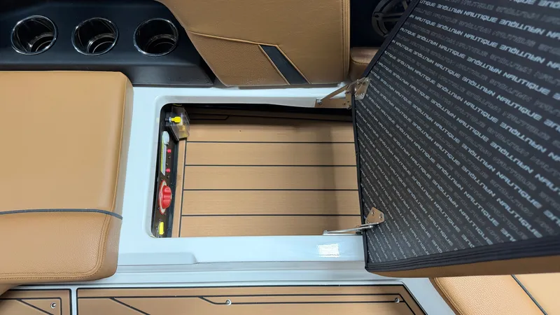 Slide: The Image of The image shows the interior of a 2026 Nautique Super Air Nautique GS20 with an open storage compartment. - 40