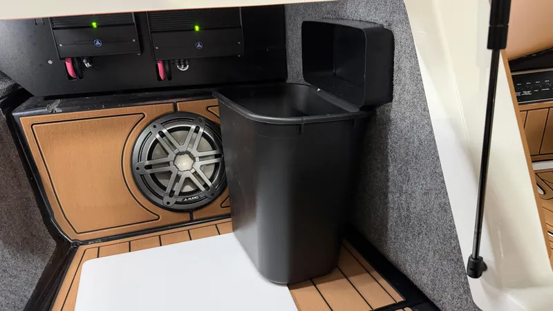 Slide: The Image of Interior of a Nautique Super Air Nautique GS20 with speaker and trash bin. - 45