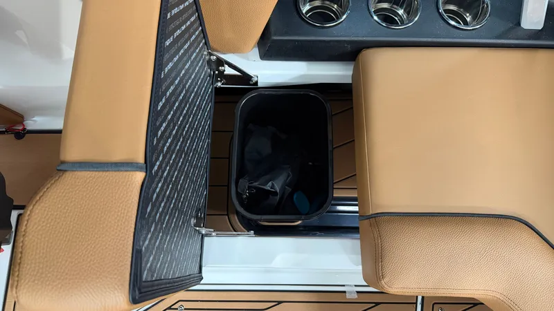 Slide: The Image of The image shows the interior of a Nautique Super Air Nautique GS20 with brown seats and a trash bin. - 30